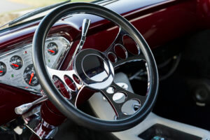 Custom steering wheel of polished chrome and black leather cover