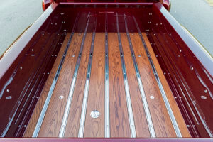 The truck bed showing the custom work done with wood and chrome.