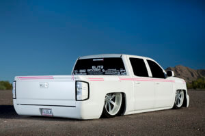 Rear view of David Ferrara's custom Chevrolet Silverado showing the detail work on the body, euro taillights and lowered stance.