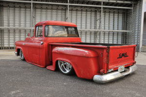 Rear view of Jeff Crumpler's custom 1958 GMC 100 with the red patina'd exterior.