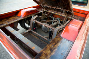 An access panel built right into the bed floor features hood hinges from a 1972 nova and a C-10 hood latch.