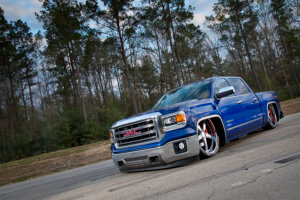 Custom blue GMC Sierra front quarter view