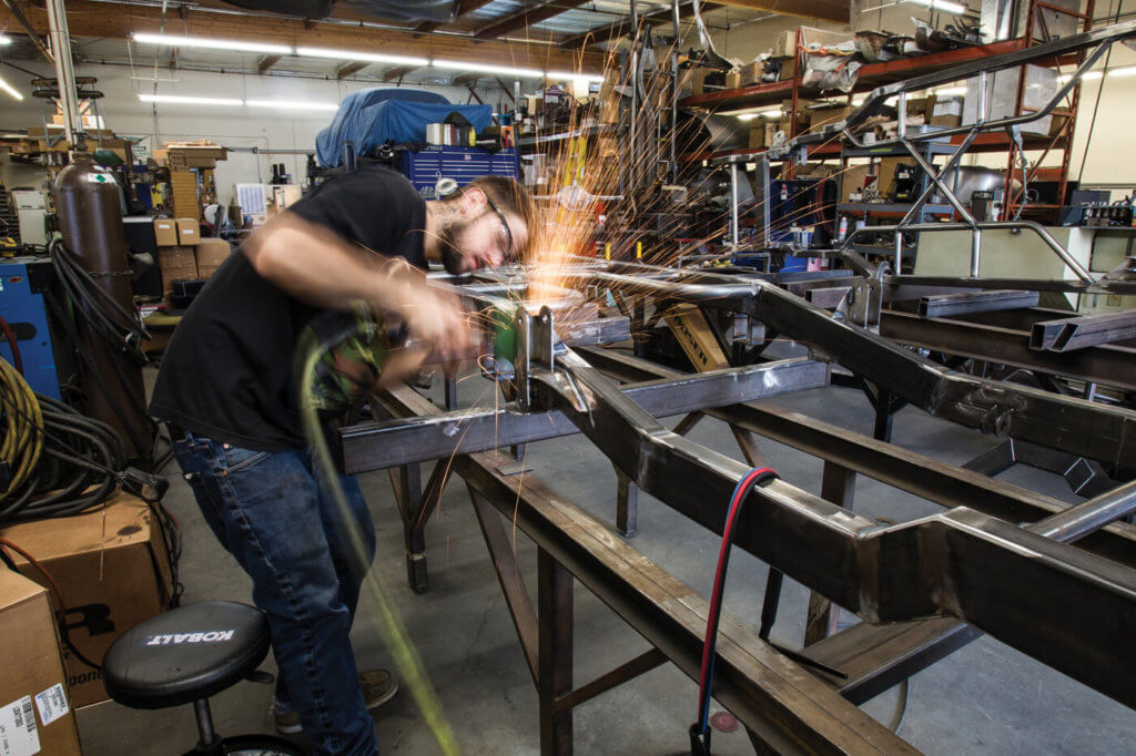 One member of the SHR crew is seen here tossing sparks installing the company’s suspension goods on a full custom frame.