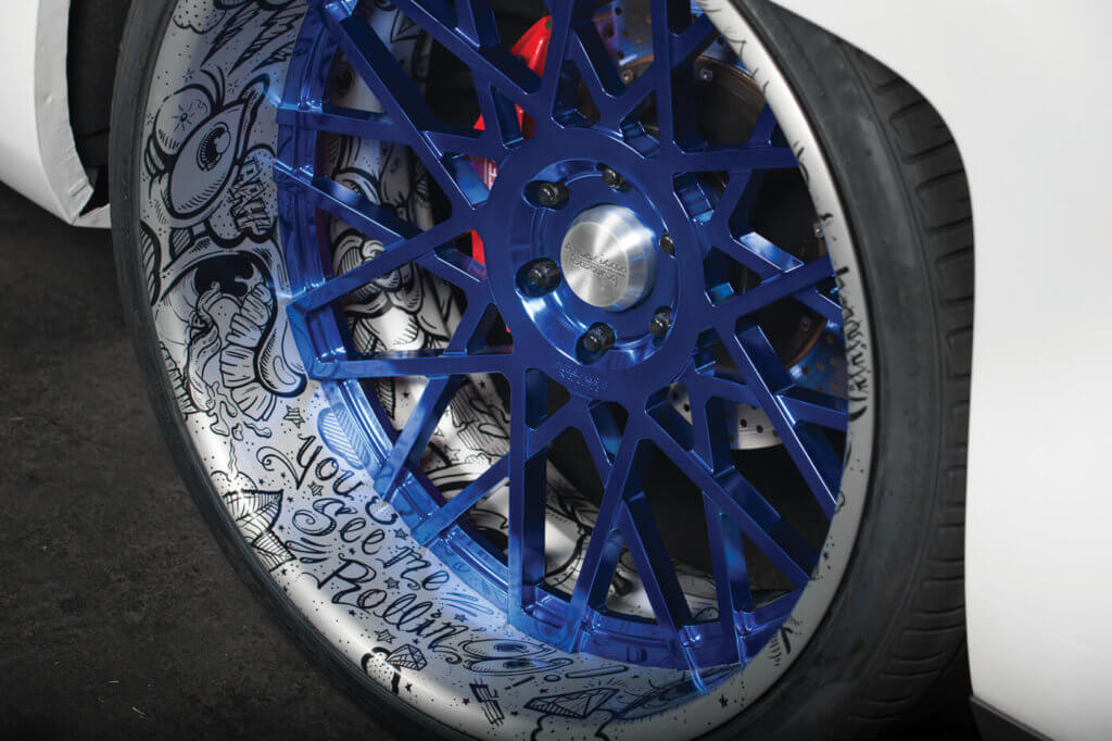 These American Racing VF 502 concave mesh billet 26-inch wheels were custom made for this truck. Chad laid down artwork on the lips and had the wheels powder-coated by New Year Metal Finishing.