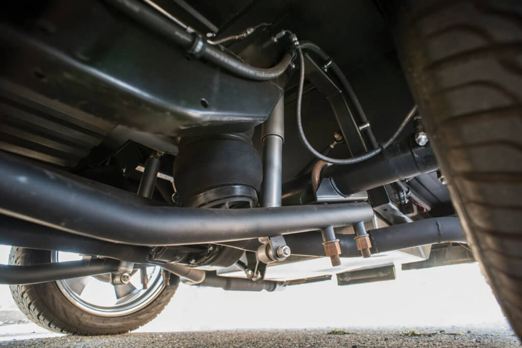 We really dig the suspension treatment on Jeff’s F-100, which was taken care of by Grossi’s Speed & Fab. A unique take on trailing arms, it also provides extra clearance, extra travel and extra style points.