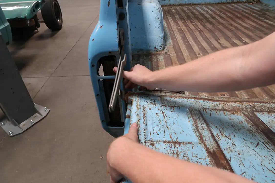 The tailgate came off next so that they could access the rear part of the bed