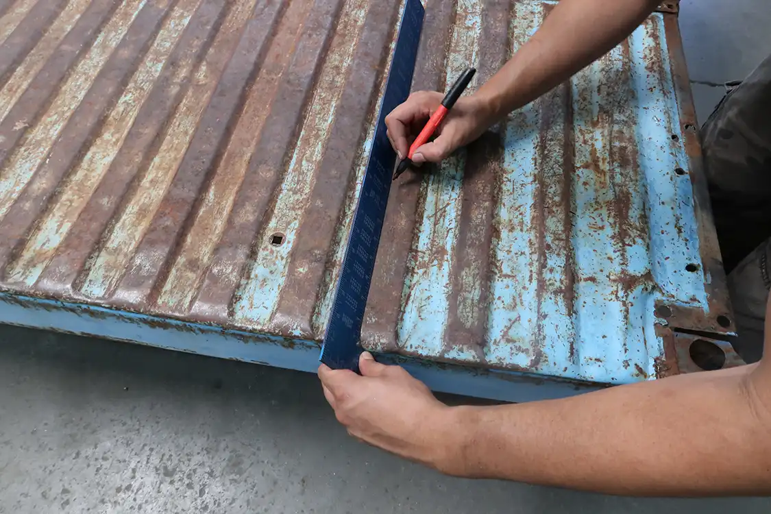 Moving to the bed floor, Kyl marked out 8 inches from the tailgate side of the bed