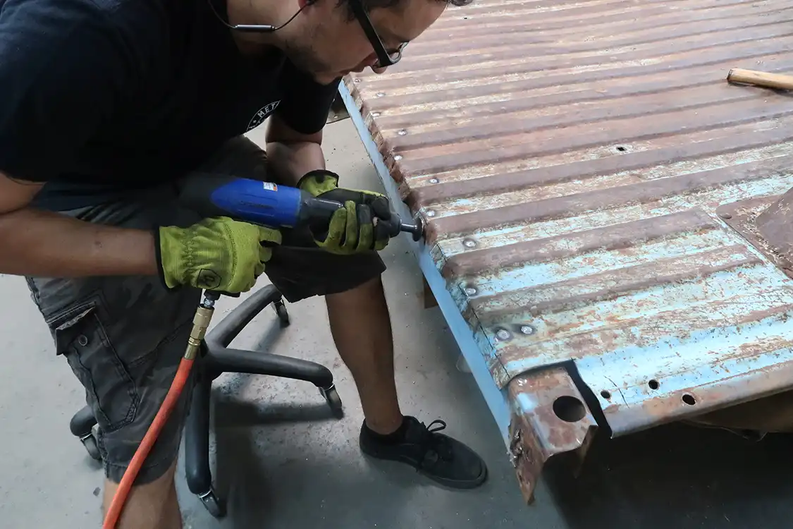 he hammers it down with an air hammer