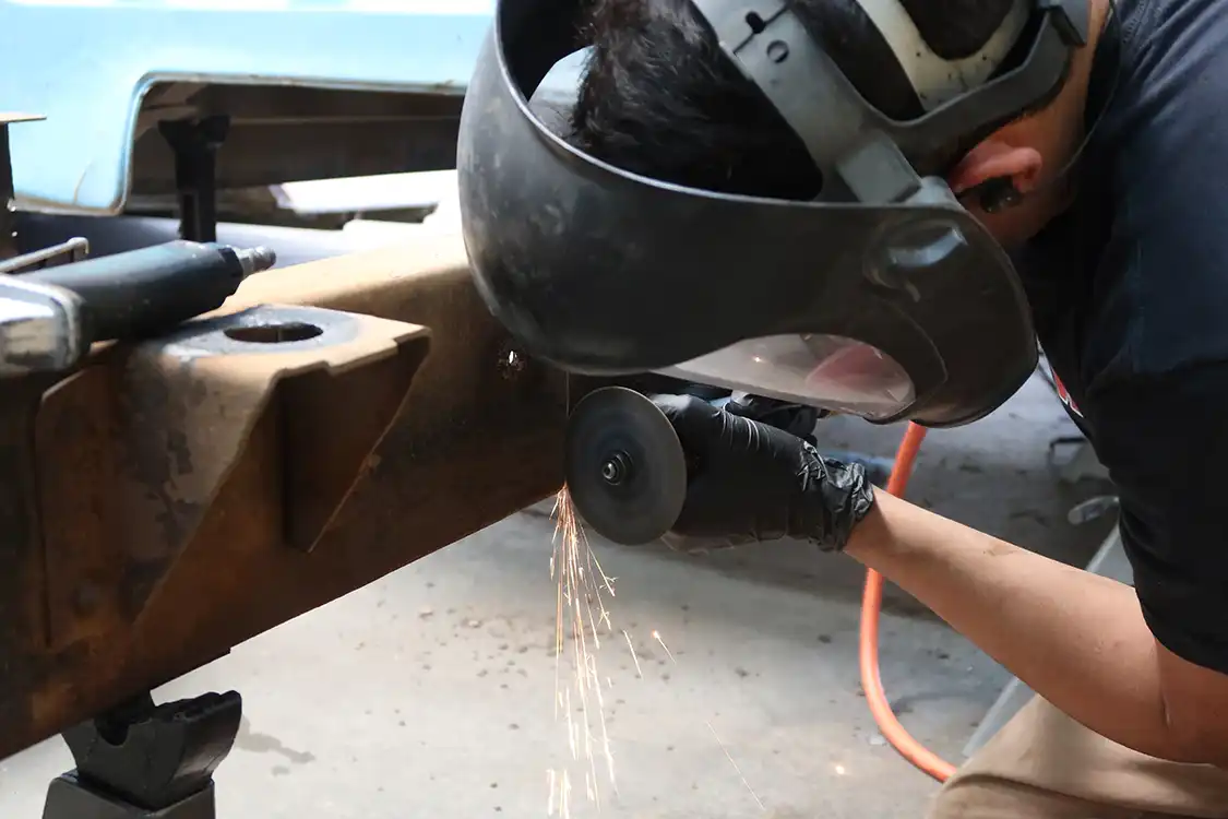 Kyle lops off the remaining 12 inches with a die grinder