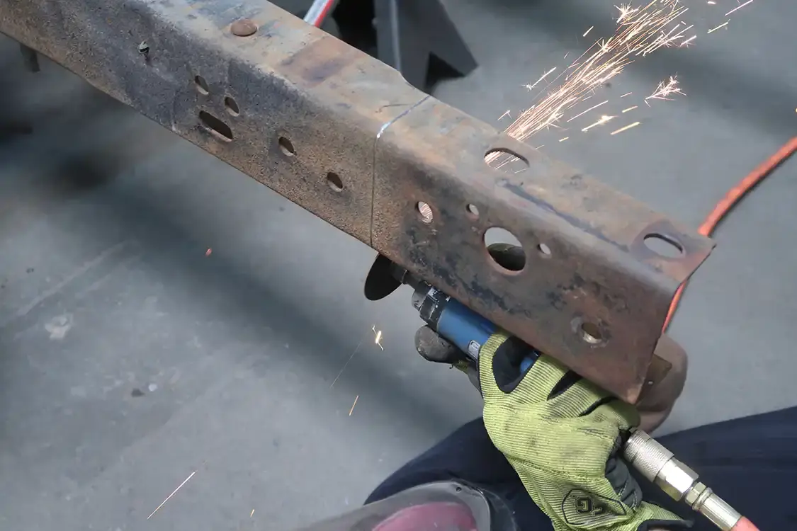 Kyle measures and cuts eight inches out of the rear