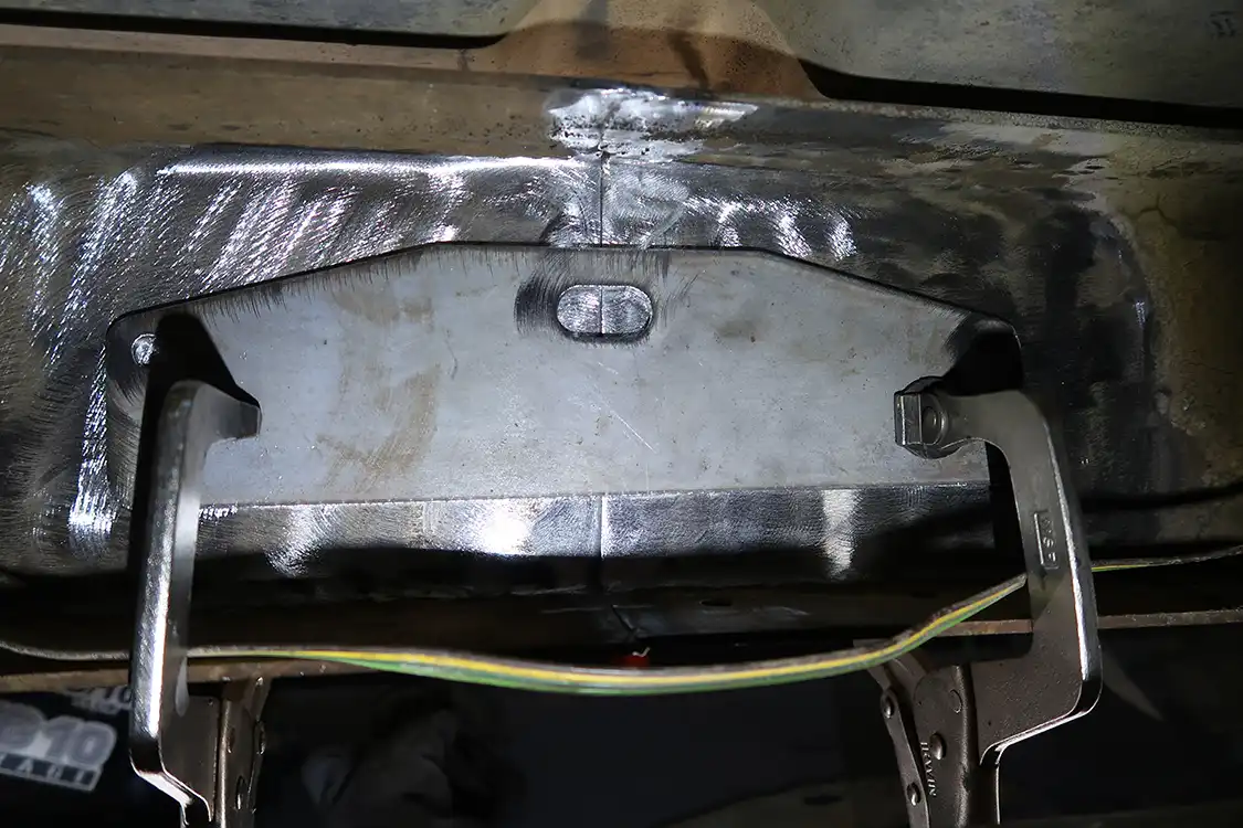 They’re designed to sit right over the seam, then get plug and stitch welded to the frame