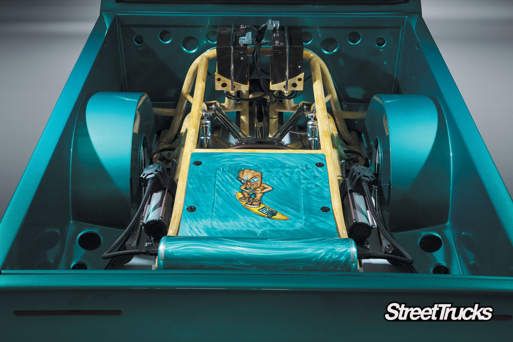 1990s turquoise Nissan hardbody truck bed with suspension