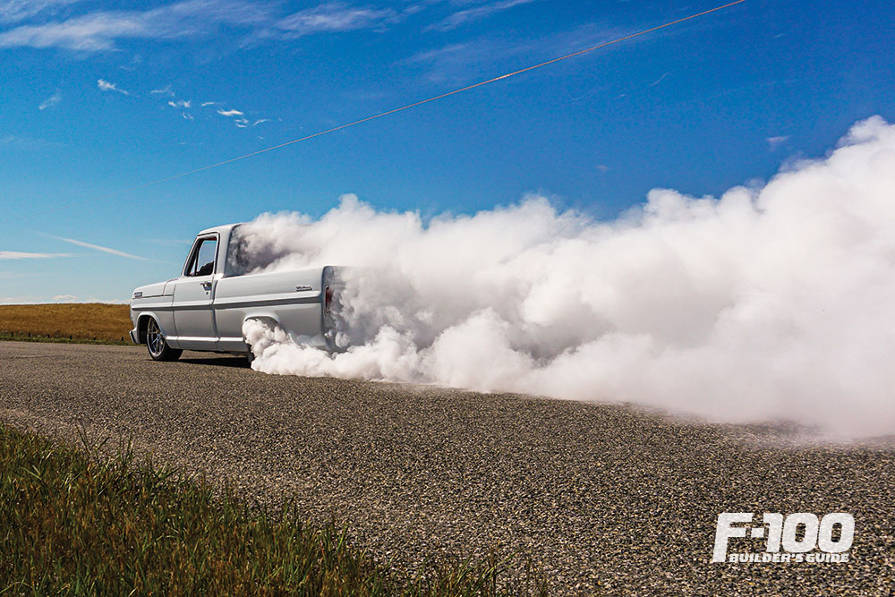 White F-100 doing a burn 