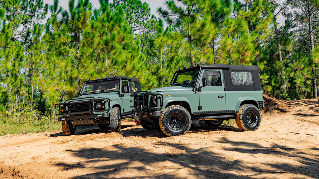 two Land Rover Defender 90s